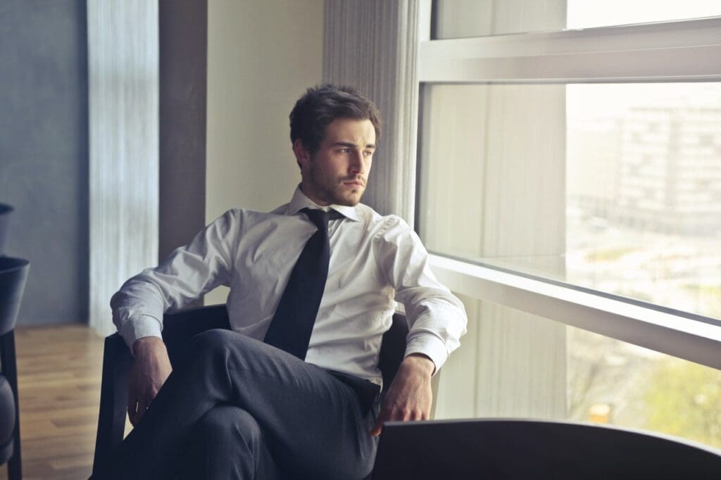 Man meditating to feel relaxed, and accomplished
